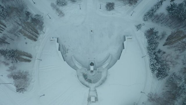 flying a drone over the central place of the city of Ust Kamenogorsk, strelka district, winter cloudy weather, city view