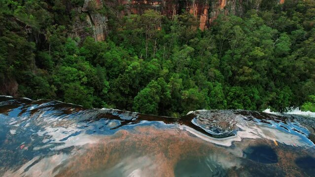 Belmore Falls, Australia, Drone Slowly Pans Down over Waterfall Edge