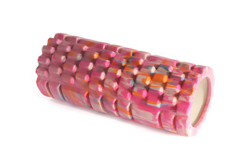 A pink foam massage roller isolated on a white background. Foam rolling is a self myofascial release technique. Gym fitness equipment.