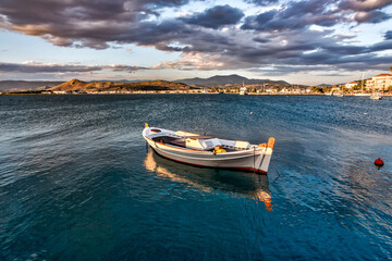 Naklejka na ściany i meble greek traditional fishing boat in the bay