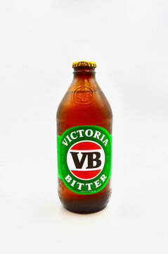 A Closeup Of A Stubby Of Victoria Bitter Against A White Background