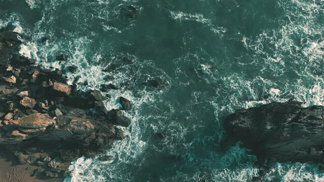 Ocean waves crashing on wild coastline in South Devon, England