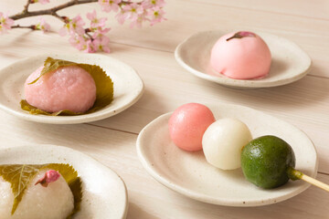 Japanese sweets in spring. Three-color dumplings, sakura mochi, buns....