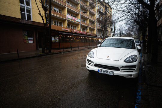Ivano-Frankivsk, Ukraine - March, 2023: White Porsche Cayenne on street.