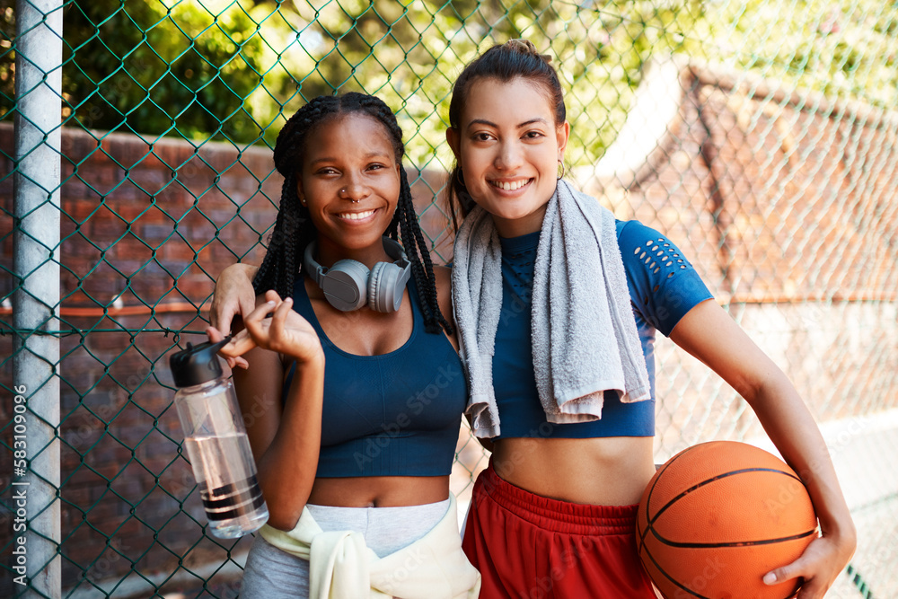 Sticker Were best friends and basketball lovers. Portrait of two sporty young women standing against a fence on a sports court.