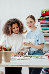 Fototapeta premium Craft Marketing Ideas for Small Businesses. Smart Marketing Strategies for Handmade Businesses. Female designers working together and making jewelry