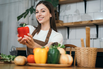 Woman preparing healthy food in her kitchen.