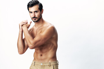 Fototapeta premium Male athlete model with naked torso and packs of abs sporty on white isolated background, trendy clothing style, copy space, space for text