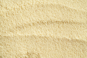 Background made of almond flour, top view