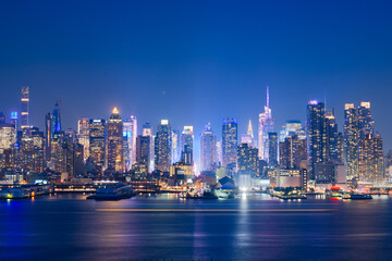 Fototapeta premium New York, New York, USA midtown skyline at dusk from the Hudson River