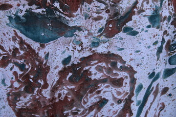 Close up original beautiful unique marble pattern paper  interior of book cover, fabric abstract design brown blue colour tones created ancient texture oil paint turps technique of  mix swirl on water