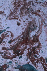 Close up original beautiful unique marble pattern paper  interior of book cover, fabric abstract design brown blue colour tones created ancient texture oil paint turps technique of  mix swirl on water