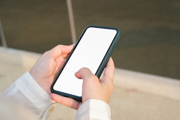 business woman hand using smart phone for shopping online on outdoor background. texting on her smart phone.