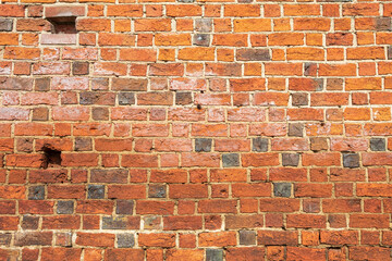 The texture of the walls of red-clay bricks