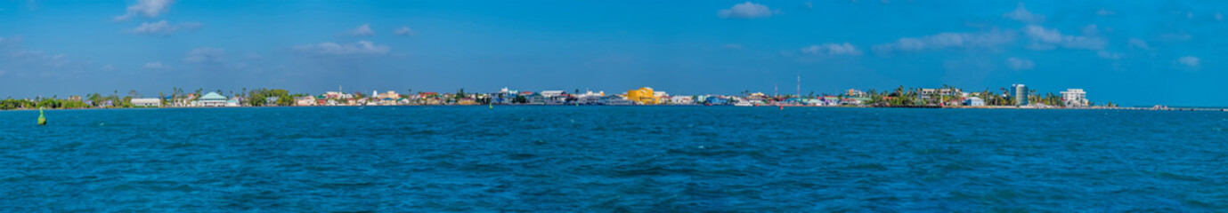 Fototapeta premium A panorama view approaching Belize City, Belize from the sea on a sunny day