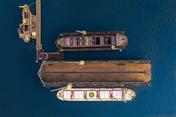 Aerial top view container oil ship in shipyard for repair and maintenance.