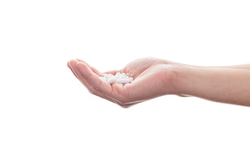 Hand holding pills isolated on white background with clipping path.