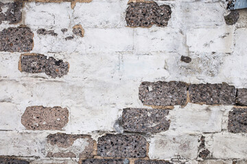 Old brick white gray color wall background. Light stone texture