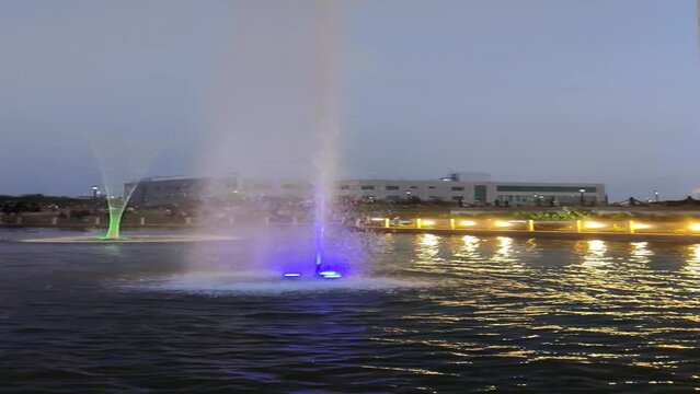 Slow motion footage of fountain in a pond shot in City Park Mansarovar at night
