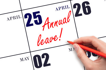 Hand writing the text ANNUAL LEAVE and drawing the sun on the calendar date April 25