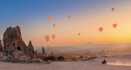 Safari trip ATV quad bike with set colorful hot air balloon in Cappadocia Goreme Turkey banner © Parilov