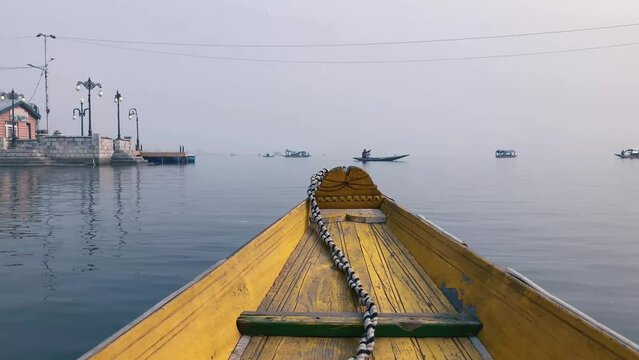 yellow boat in the dal lake Kashmir India