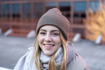 Portrait of a young Caucasian woman looking into camera and smiling