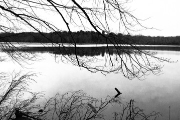 A dark and dreary day at the lake as winter begins to fade.