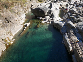 The crystalline and emerald waters in the canyons of the Verzasca river. Lavertezzo, Switzerland.