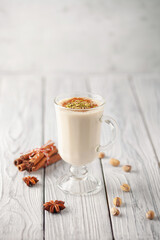Turkish traditional hot drink salep on white wooden background