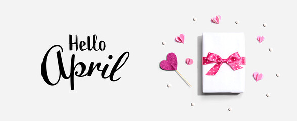 Hello April message with a gift box and paper hearts