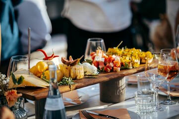 Wooden platter with gourmet appetizers on a restaurant table