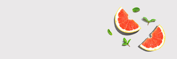 Fresh grapefruits and mints overhead view - flat lay