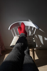 feet on chair soaking up the first rays of spring sun
