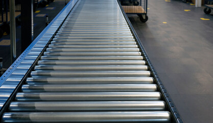 Fototapeta premium Conveyor belt inside a manufacturing site or distribution warehouse