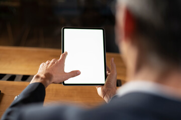 Close up of man using digital tablet