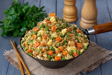 Cauliflower Fried Rice. Healthy, low-carb dish made with grated cauliflower, eggs, peas, carrots,...
