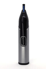 Compact electric nose and ear hair trimmer on white background. Removal of unwanted nose, ear and facial hair. Trimming the edge of the beard, mustache, eyebrows. 