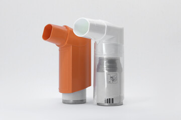 Set of inhalers for asthma and COPD patients on a white background. Pharmaceutical used to treat lung inflammation and prevent asthma attack symptoms. Health and Medical Concepts. A place to copy. - obrazy, fototapety, plakaty