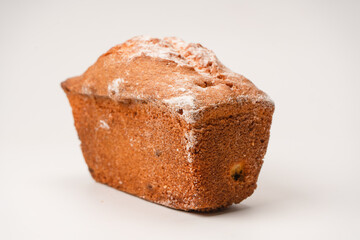 A cupcake with raisins isoalted on a white background.