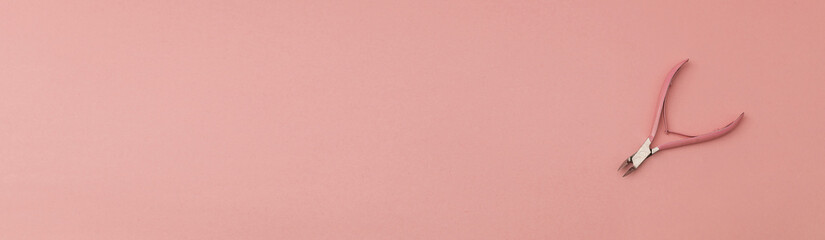 Banner with nail clippers for manicures