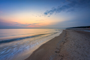 Beach of the Baltic Sea in Gdansk at sunrise. Poland