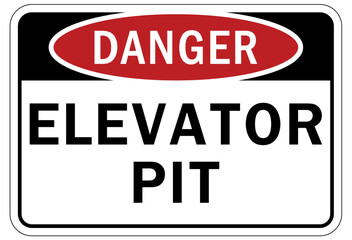 Elevator warning sign and labels elevator pit
