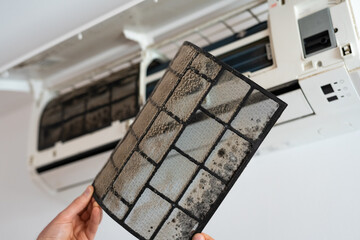 Air conditioner filter dusty. Preparation for maintenance and cleaning. - obrazy, fototapety, plakaty