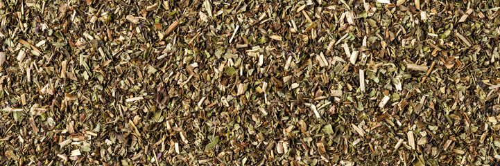Dried oregano texture. Background with copyspace. Close up. Top view