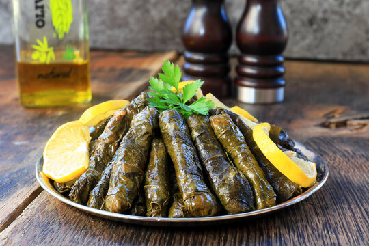 dolma - yaprak dolma sarma stuffed grape leaves rice, Lebanese dolma sarma on plate. Lebanon turkish greek middle eastern cuisine.