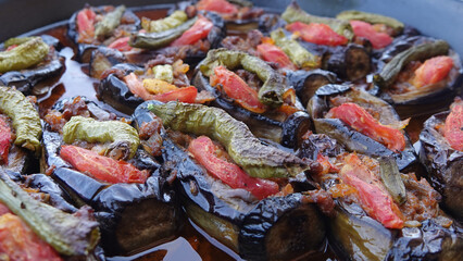 Traditional Turkish food eggplant stuffed / filled with minced meat, tomato, pepper. This food as known Karniyarik or Imam Bayildi. Popular Turkish or Greek fresh food. Ramadan menu