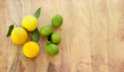 Fototapeta na wymiar Different refreshing citrus fruits. Cocktail ingredients.Fresh fruits citruses on a dark wooden background. Fruit set.Green lemon