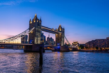 Scenic shot of the Tower Bridge and the city skyline in London, Europe during dusk