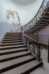 Vintage forged cast iron spiral staircase at the old mansion